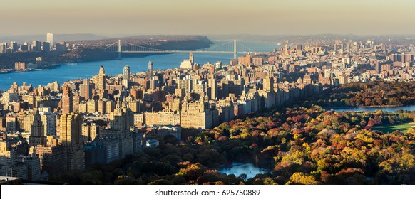 Panoramic elevated view of Central Park, Upper West Side and the George Washington Bridge with Hudson River in Fall. Manhattan, New York CIty - Shutterstock ID 625750889