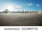 Panoramic empty wide asphalt road and modern city skyline under the sunlight.