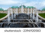 Panoramic evening view of the famous Belvedere Castle, built as the summer residence of Prince Eugene of Savoy in Vienna, Austria. View of the fountain, park and Belvedere in the autumn evening.