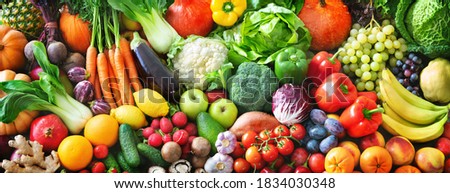 Panoramic food background with assortment of fresh organic fruits and vegetables for a balanced diet. Healthy food concept
