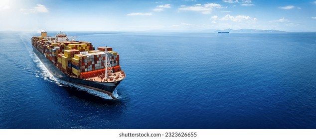 Panoramic front view of a large cargo ship carrying containers for import and export, business logistic and transportation in open sea with copy space 