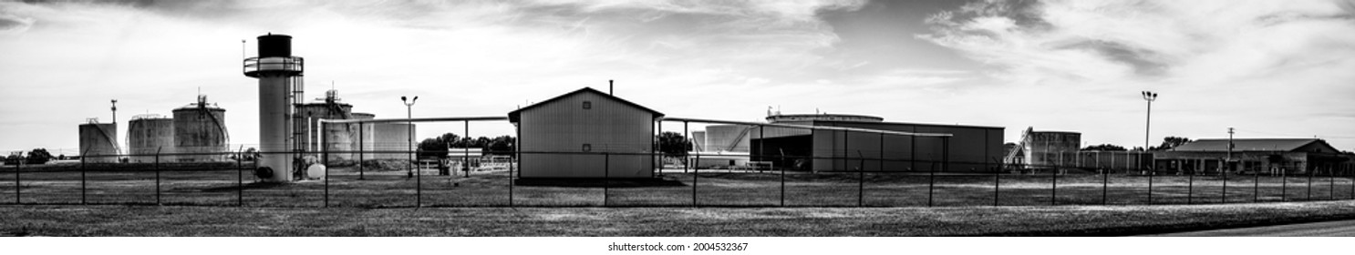 Panoramic Generic Chemical Tank Farm With Fencing And Emergency Flare