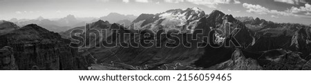 A panoramic grayscale view of the Marmolada Dolomite mountains in Italy