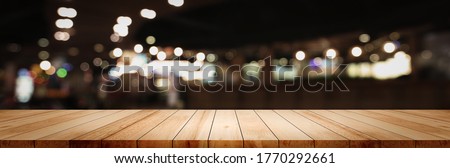 Panoramic grunge wood counter table top blur night city supermarket cafe background pub coffee desk product montage dark scene, Wide texture banner shelf bar in luxury restaurant food kitchen backdrop