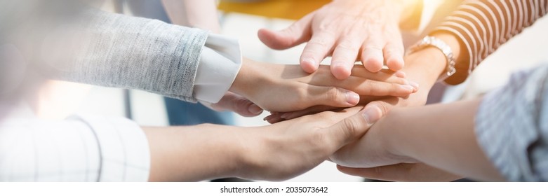Panoramic header image of hand for work together concept, Hand stack for business and service, Volunteer or teamwork togetherness, Connection of community and charity. Team participation. - Shutterstock ID 2035073642