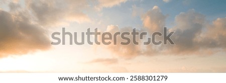 Panoramic high-resolution sky background with soft clouds at sunrise or sunset 