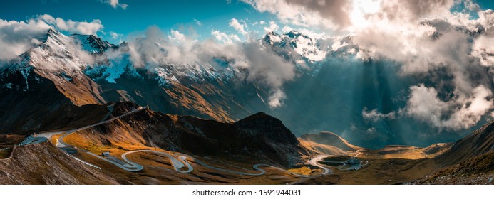 Panoramic Image Of Grossglockner Alpine Road. Curvy Winding Road In Alps. Dramatic Sky.