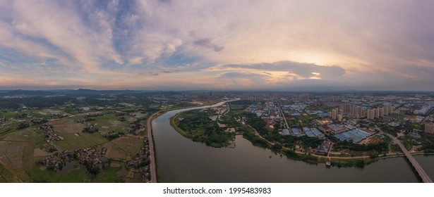 Panoramic Image Of An Industrial Park In Shenzhen, Guangdong Province, China. The Vast Sky And The Winding River. The Theme Picture Of China's Industrial Development And Integration Of Urban And Rural