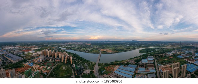 Panoramic Image Of An Industrial Park In Shenzhen, Guangdong Province, China. The Vast Sky And The Winding River. The Theme Picture Of China's Industrial Development And Integration Of Urban And Rural