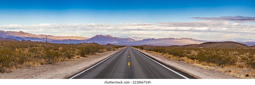 Panoramic image of a lonely, seemingly endless road in the desert of Southern California
