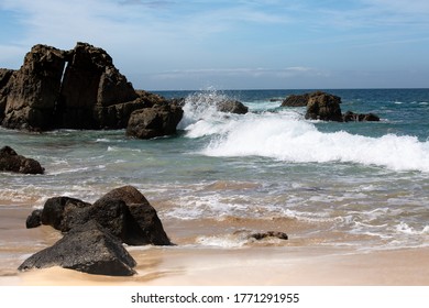 Panoramic image of the ocean sand and cliffs