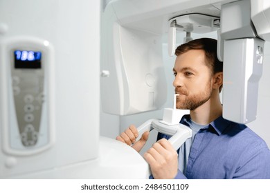 Panoramic image of teeth. A patient in a modern dental clinic takes a panoramic picture of the teeth. Prevention of dental diseases. Accurate diagnosis.Side view. - Powered by Shutterstock