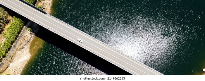 Panoramic Image, View From Above Bridge Across Reservoir, Aerial Shot, Sunny Day Green Water Dam Of Avila. Europe, Spain