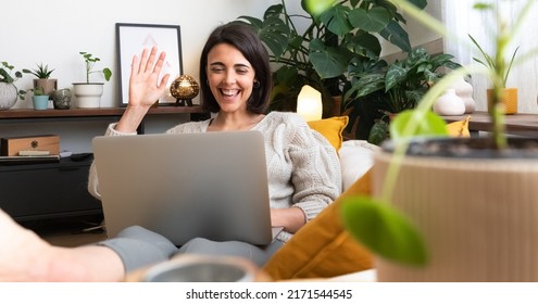 Panoramic Image Of Young Happy Caucasian Woman Waving Hand Hello During Online Video Call At Home Cozy Living Room.