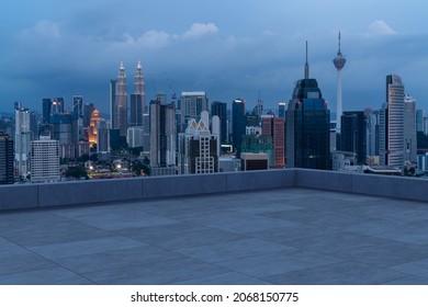 Panoramic Kuala Lumpur skyline view, concrete observatory deck on rooftop, night. Asian corporate and residential lifestyle. Financial city downtown, real estate. Product display mockup empty roof - Shutterstock ID 2068150775