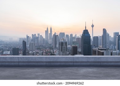 Panoramic Kuala Lumpur skyline view, concrete observatory deck on rooftop, sunset. Asian corporate and residential lifestyle. Financial city downtown, real estate. Product display mockup empty roof - Powered by Shutterstock