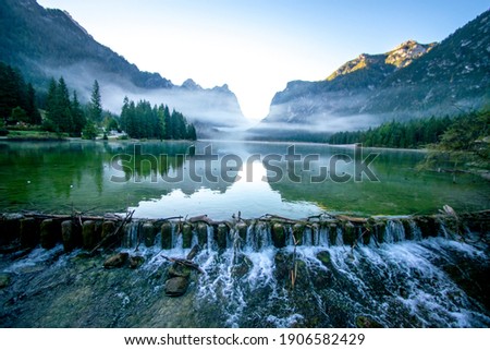 Panoramic lake Lago di Dobbiaco. Travel nature. Fantastic evening panorama.