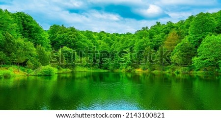 panoramic lake landscape. Nature view on beautiful lake with green trees. Lake scene in magnificent nature of Turkey. panoramic nature background theme. Uludag mountain national park, Bursa, Turkey.
