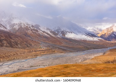 Panoramic landscape of braided Spiti river valley and snow capped mountains during sunrise from Key or Kee monastery near Kaza town in Lahaul and Spiti district of Himachal Pradesh, India. 