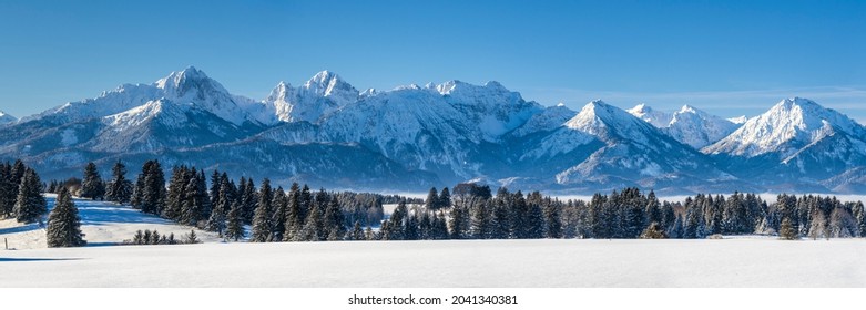 panoramic landscape in region Allgaeu in Bavaria at winter - Shutterstock ID 2041340381