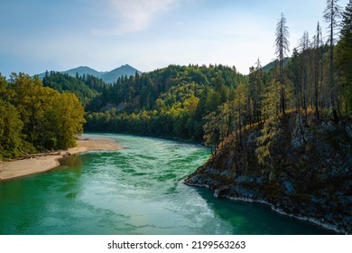 Panoramic landscape of turquoise-colored Skagit River water and green forest toward Glacier Peak over the Concrete Sauk Valley Bridge in Concrete, Washington State - Shutterstock ID 2199563263