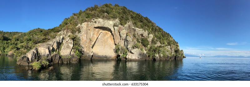 Panoramic Landscape View Of The Maori Rock Carving At Lake Taupo In The North Island Of New Zealand. No People. Copy Space