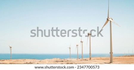 Panoramic landscape view of wind alternative energy generator farm site - Eolic electricity concept