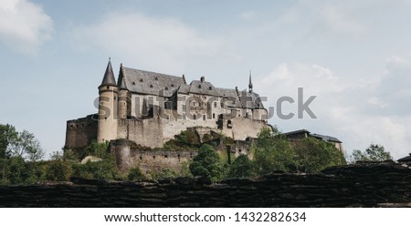 Panoramic low angle view of Vianden Castle, Luxembourg, one of the largest and finest feudal residences of the Roman and Gothic eras in Europe.