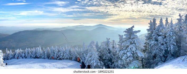 Panoramic mountain view of beautiful mountain peaks at snow day on the top of Stowe Mountain Ski resort, Vermont - December 2020