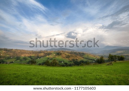 panoramic mountain view with blue cloudy sky