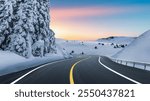 Panoramic nature road landscape in snowy mountain in winter season. Snow winter road scenery in europe trip. Winter travel in mountain highway scene. Winter landscape on sunset in snow road panorama