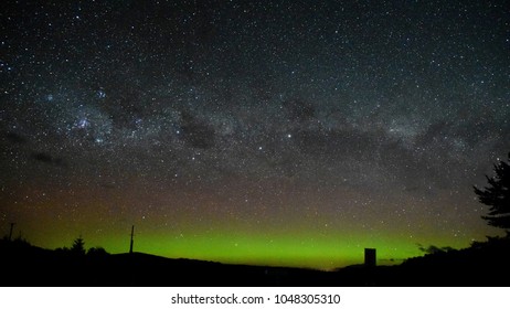 The Panoramic Night Sky Of Te Anau Downs With The Milky Way, Southern Cross And Aurora Australis.