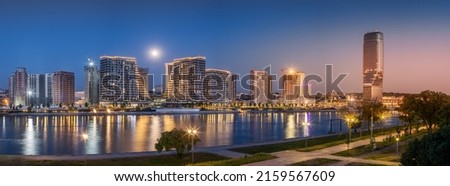 Panoramic night view of Belgrade Waterfront, Sava River, Belgrade Tower With Full Moon