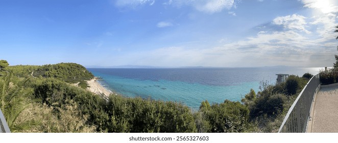 Panoramic ocean cliff top view with beach and blue sea