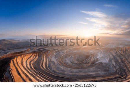 Panoramic of open pit mine industry, aerial view. Big yellow mining truck for coal working in quarry.