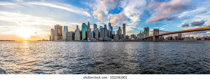 Panoramic Panorama View Of Outside Outdoors In NYC New York City Brooklyn Bridge Park By East River, Cityscape Skyline During Sunset