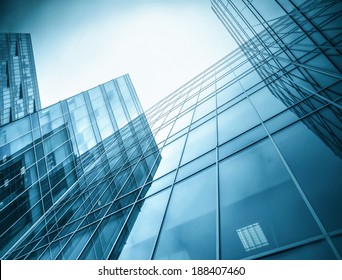 Panoramic and perspective wide angle view to steel light blue background of glass high rise building skyscraper commercial modern city of future. Business concept of successful industrial architecture - Powered by Shutterstock