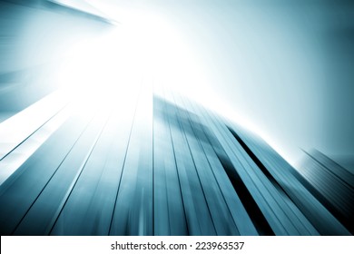 Panoramic and perspective wide angle view to steel light blue background of glass high rise building skyscraper commercial modern city of future. Business concept of success industry tech architecture - Shutterstock ID 223963537