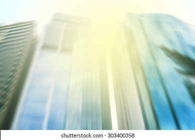 Panoramic and perspective wide angle view to steel light blue background of glass high rise building skyscraper commercial modern city of future. Business concept of success industry tech architecture