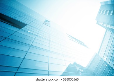 Panoramic and perspective wide angle view to steel light blue background of glass high rise building skyscraper commercial modern city of future. Business concept of success industry tech architecture - Shutterstock ID 528030565