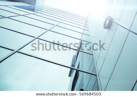 Panoramic and perspective wide angle view to steel light blue background of glass high rise building skyscraper commercial modern city of future. Business concept of success industry tech architecture