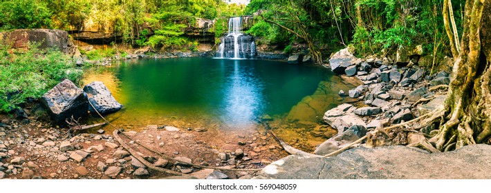 Panoramic photo landscape / Waterfall hidden in the tropical jungle surrounded by a natural swimming pool with clear fresh water on background green forest tree and mountain / Asia - Shutterstock ID 569048059