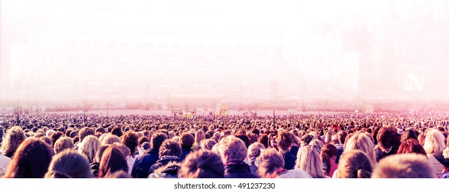 Panoramic Photo Of Large Crowd Of Unrecognizable People. Slow Shutter Speed With Motion Blur.