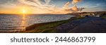 Panoramic photo of a sunset over Loch Ryan at Stranraer, Scotland, United Kingdom