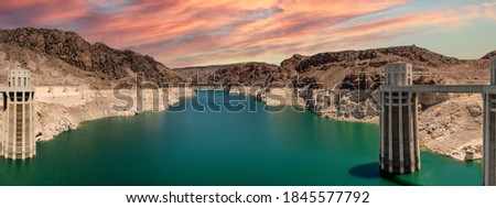 Panoramic photograph of Hoover Dam at sunset with low water level