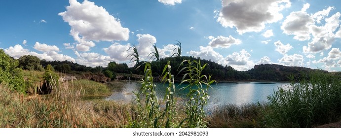 Panoramic picture of a lagoon of the ruidera lagoons with a waterfall, beautiful Spanish landscape (Spain).