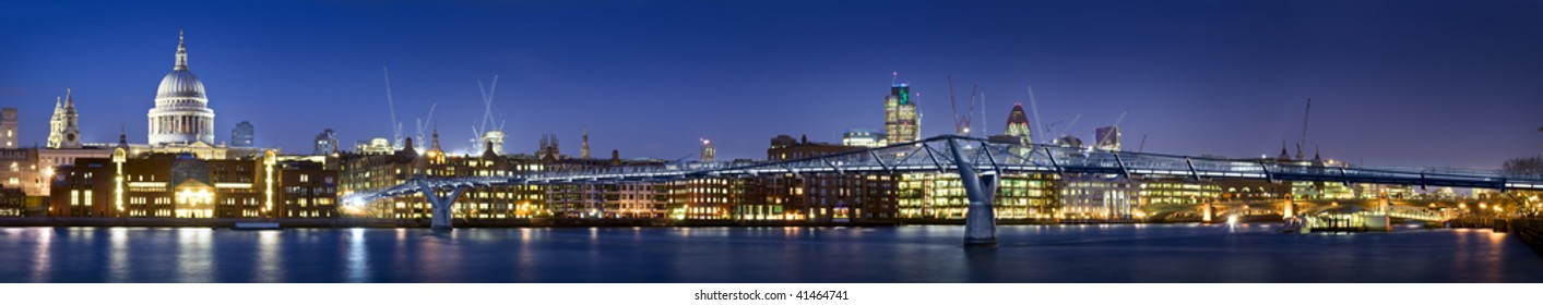 Panoramic picture of St Paul's Cathedral and Millennium Bridge at night.this view also includes tower 42 and Gherkin.