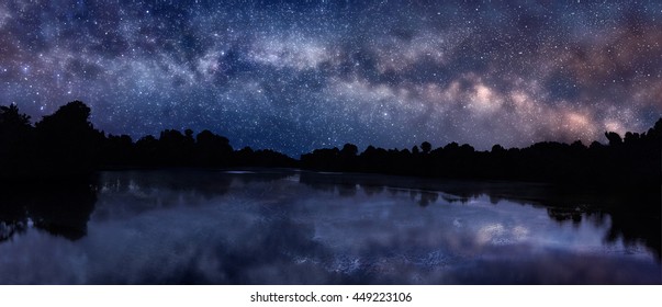 Panoramic Picture Of Starry Night Sky Over The Lake