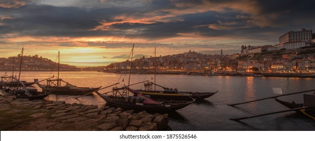 Panoramic of Porto cityscape in sunset with river on the front and wine carrier ship in  foreground and city of Porto in background, Portugal.