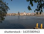 Panoramic of Prague with the river in the foreground